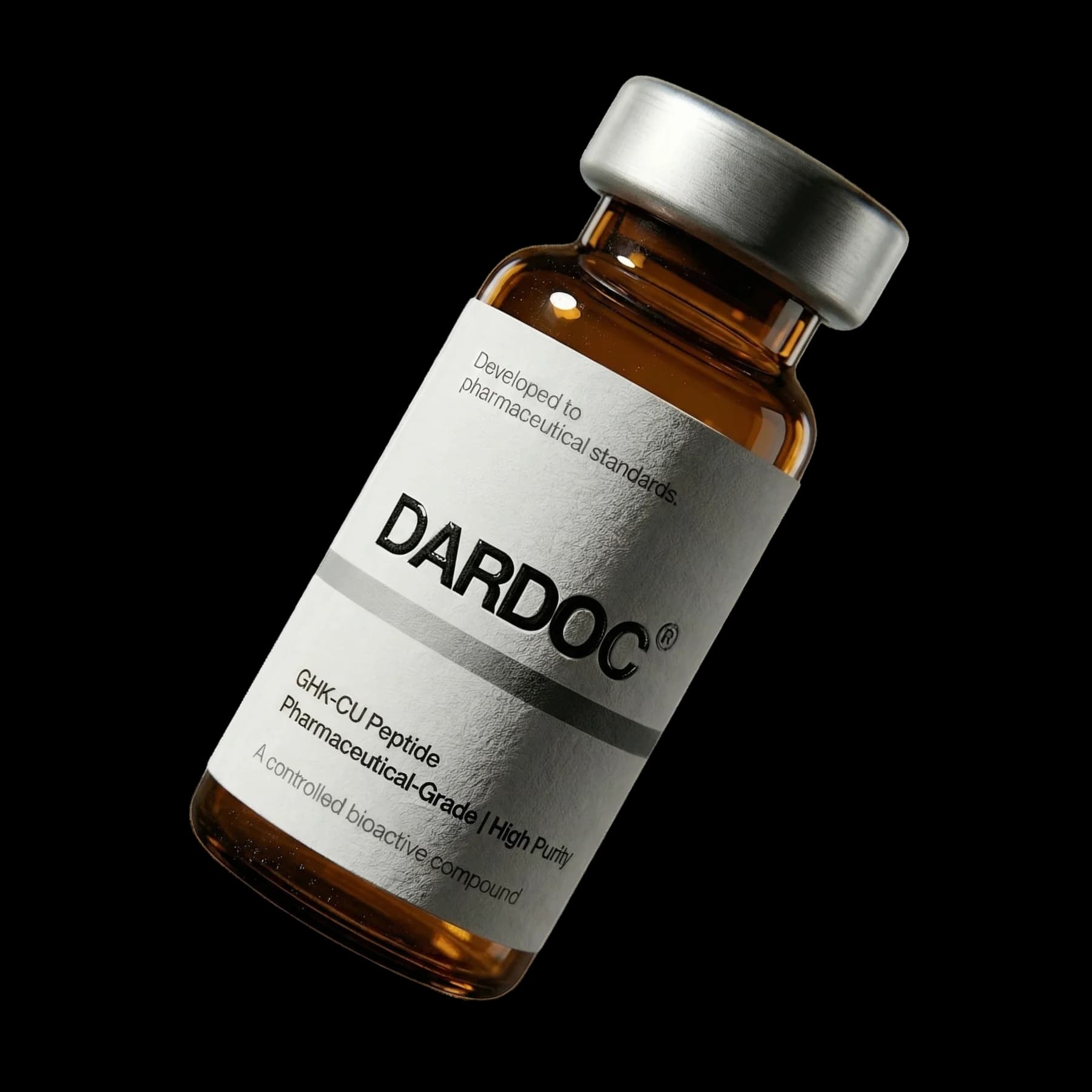 A small set of clinical-grade peptide vials and a topical serum bottle photographed against a soft cream background